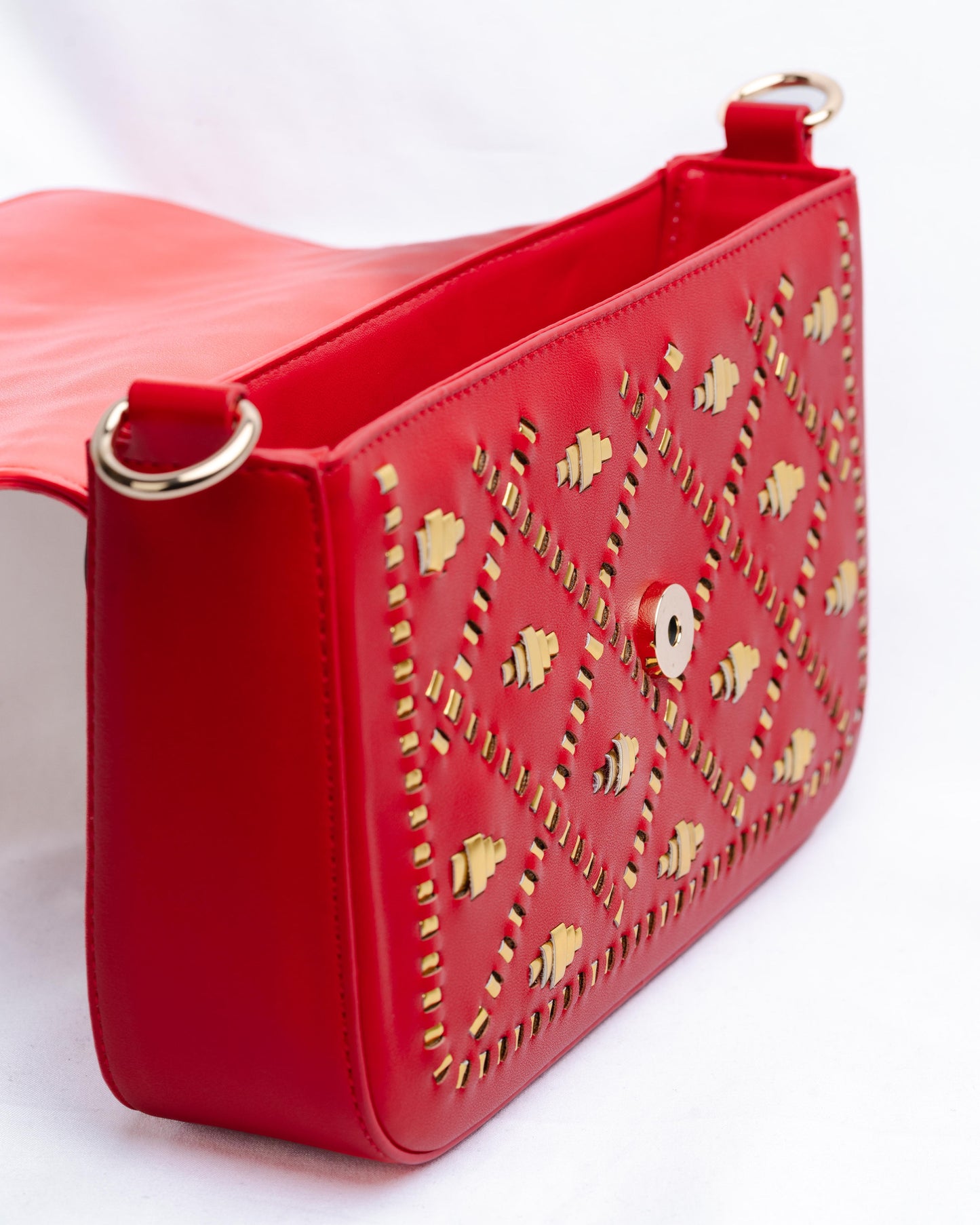 Red handbag with gold weaves.