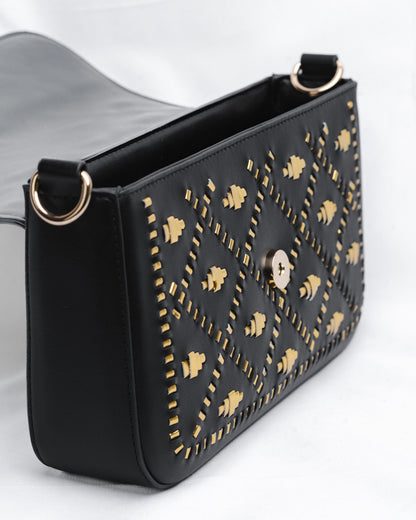 Black handbag with gold weaves.